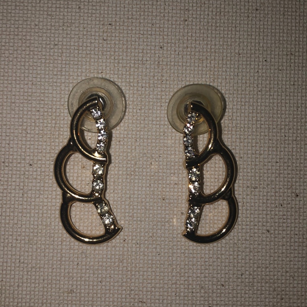 gold earrings with crystal gems.